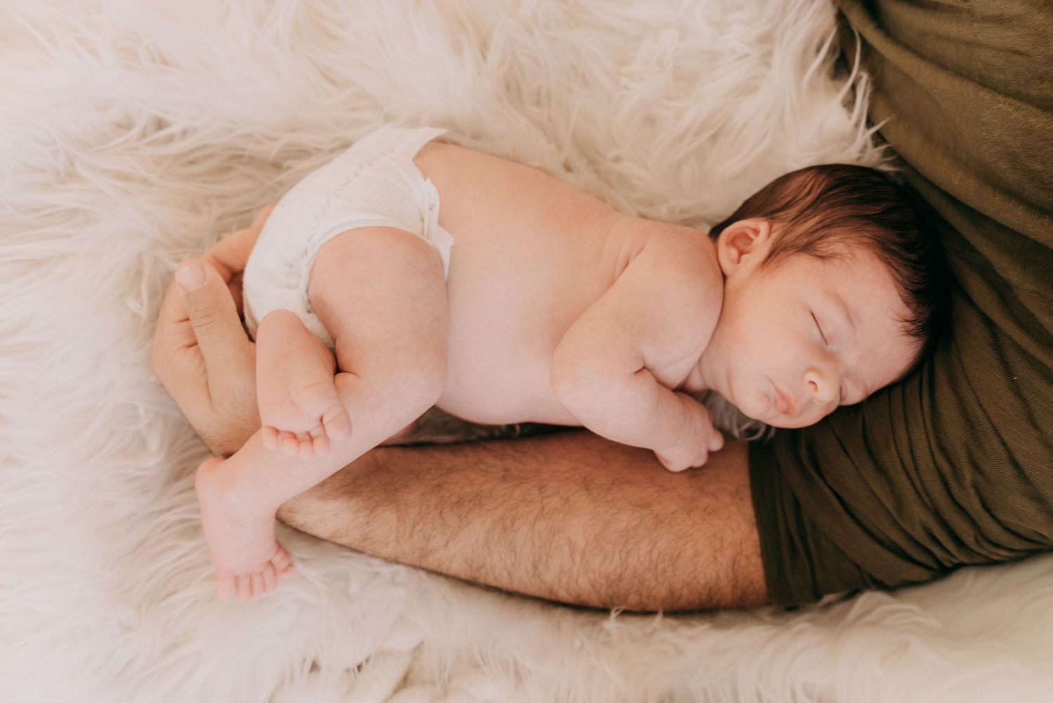 A series of connected photos showing a baby sleeping in different positions on brown bedding.
