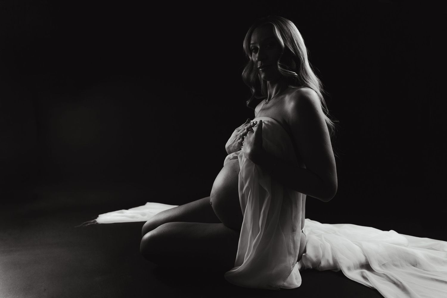 A dramatic black and white photo sequence shows a ballet dancer performing graceful movements in flowing fabric.