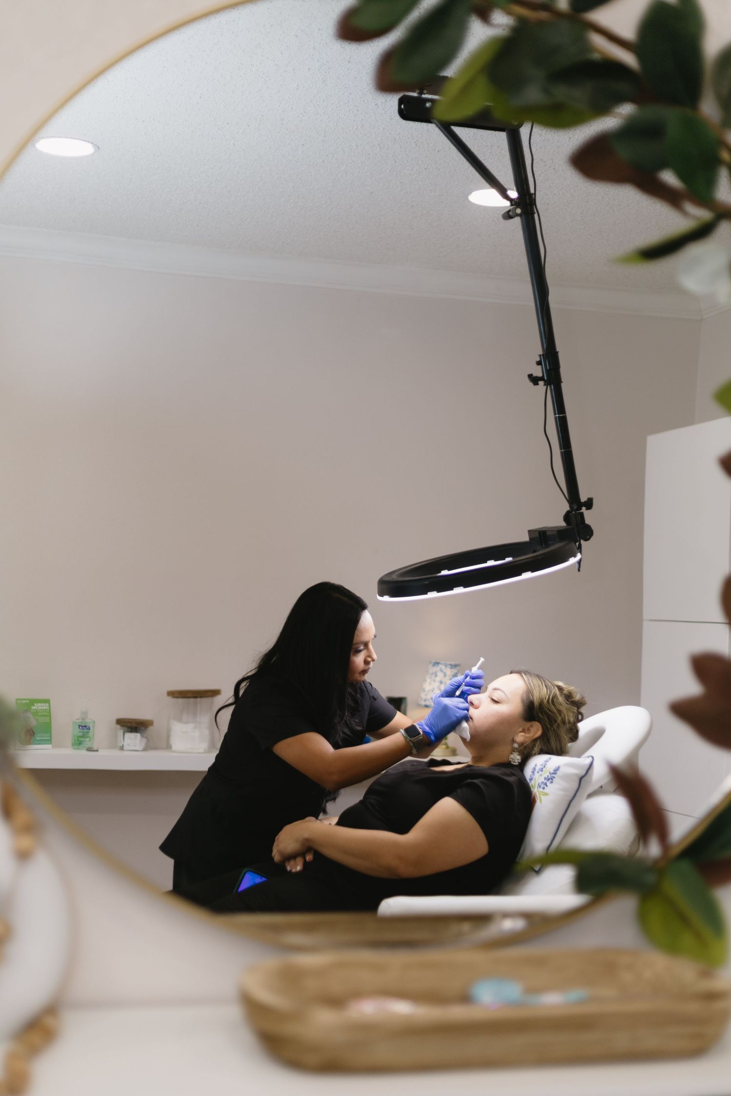 Professional photography setup showing someone reclining during a photo session.