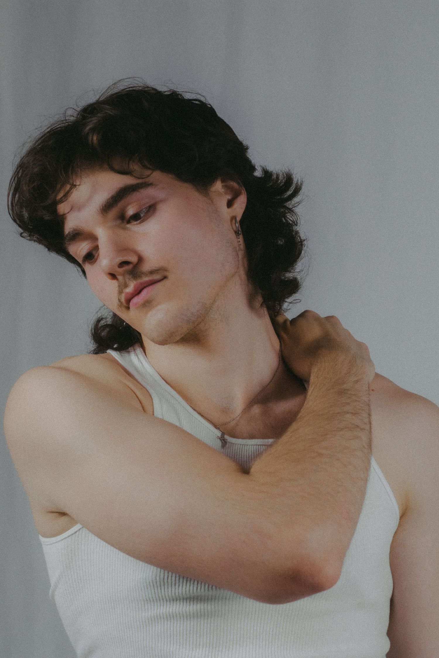 A man holding his shoulder.