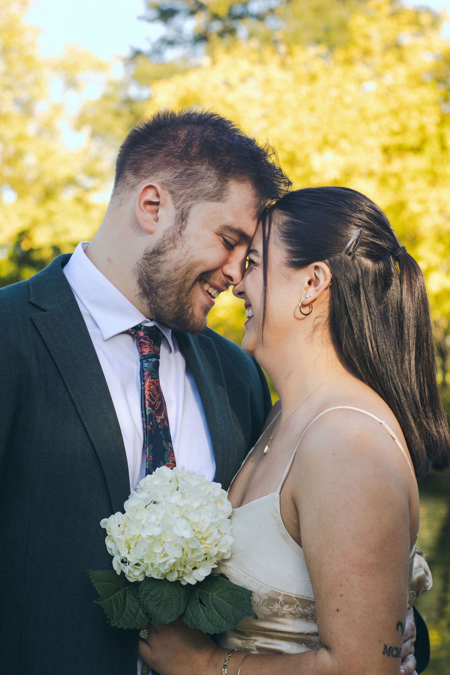 A man and woman standing closely to one another.