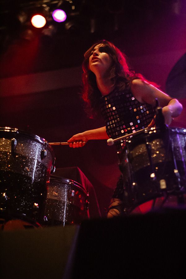 A woman playing the drums