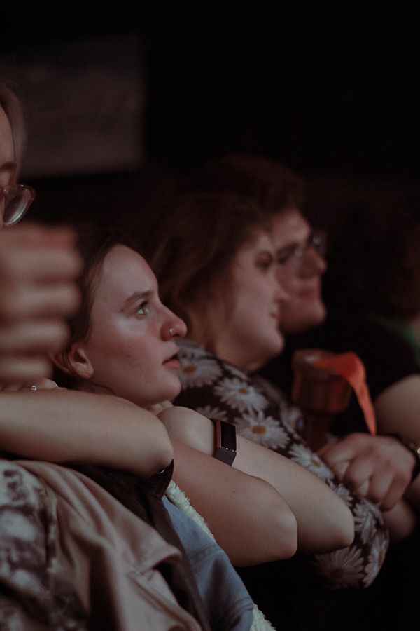 A crowd of people in the first row