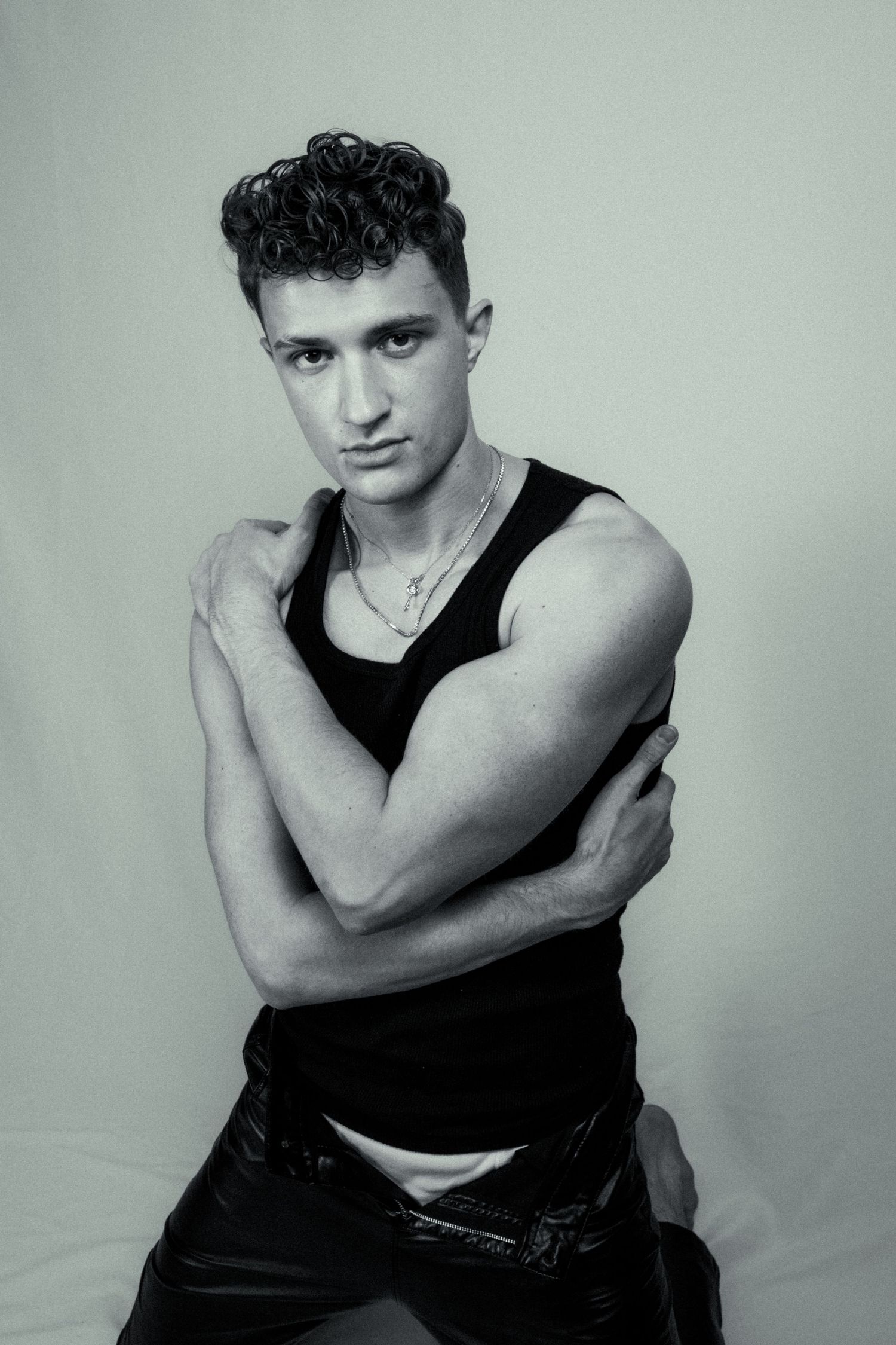 A man posing in front of a white background.