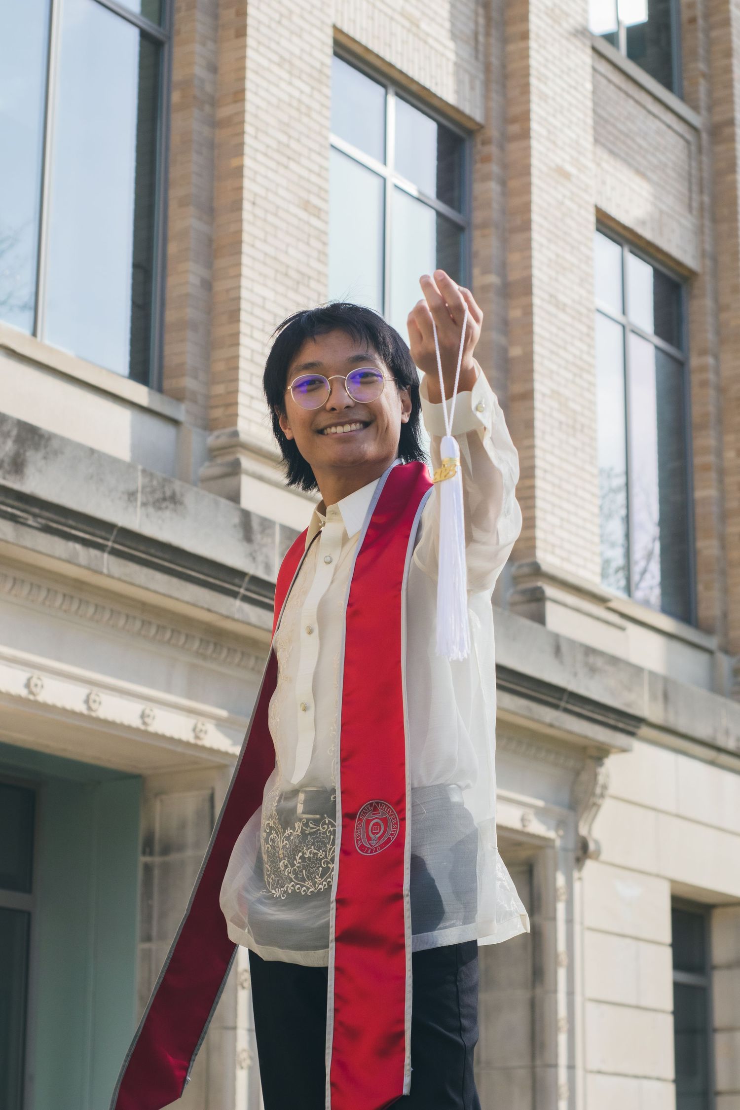 A man holding his tassel