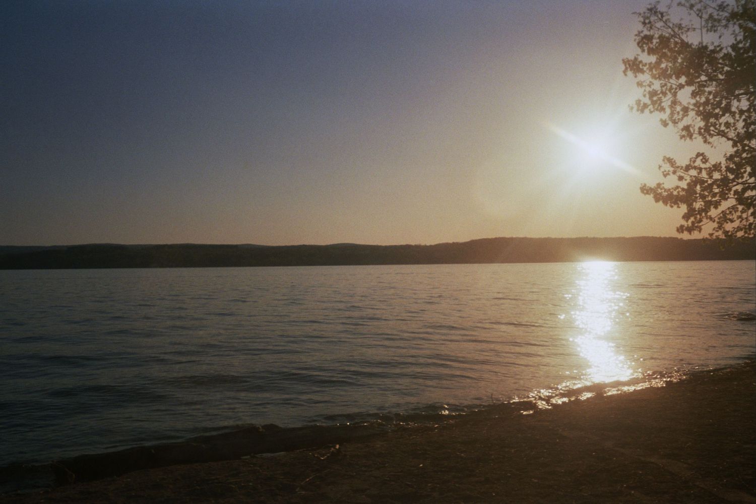 The sun above a body of water