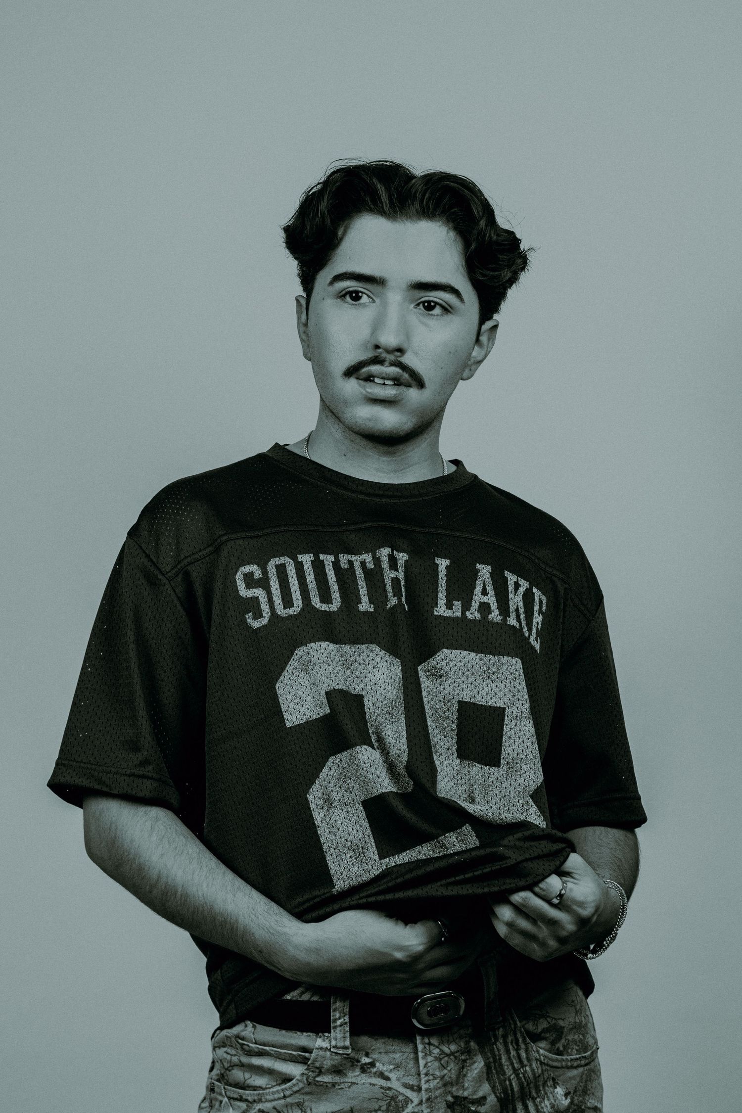A man posing in front of a white background.