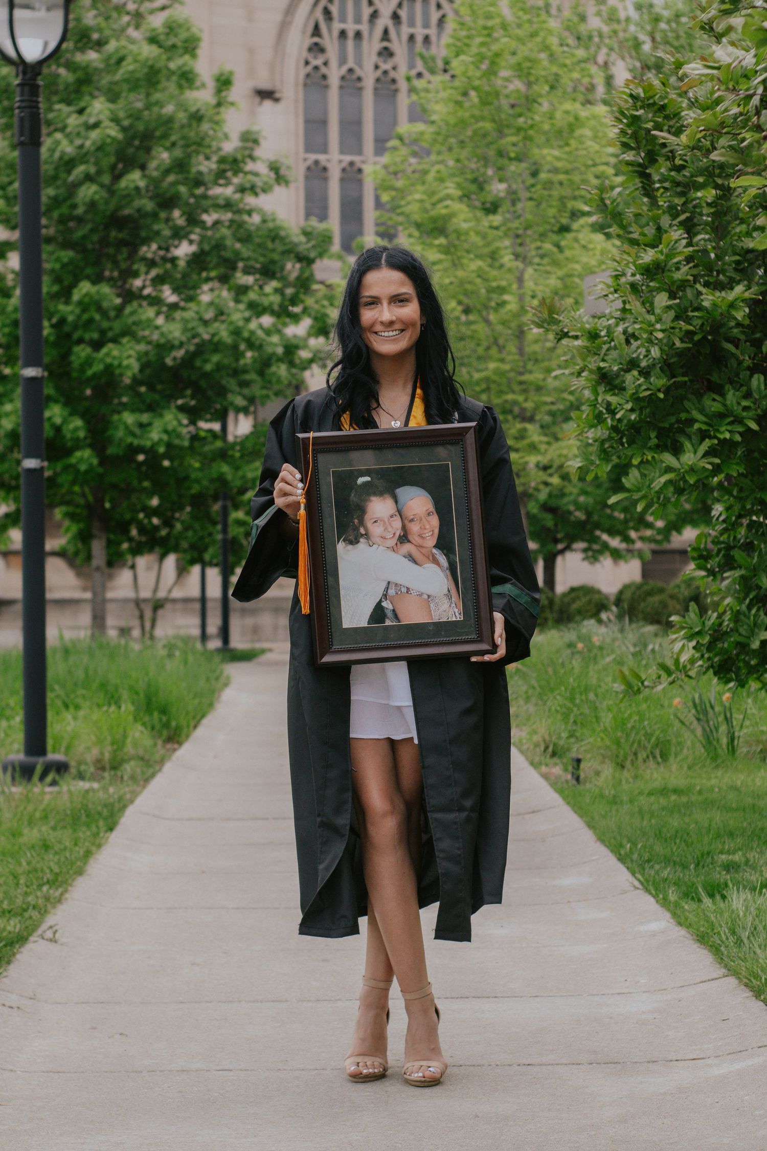 A woman holding a framed photo