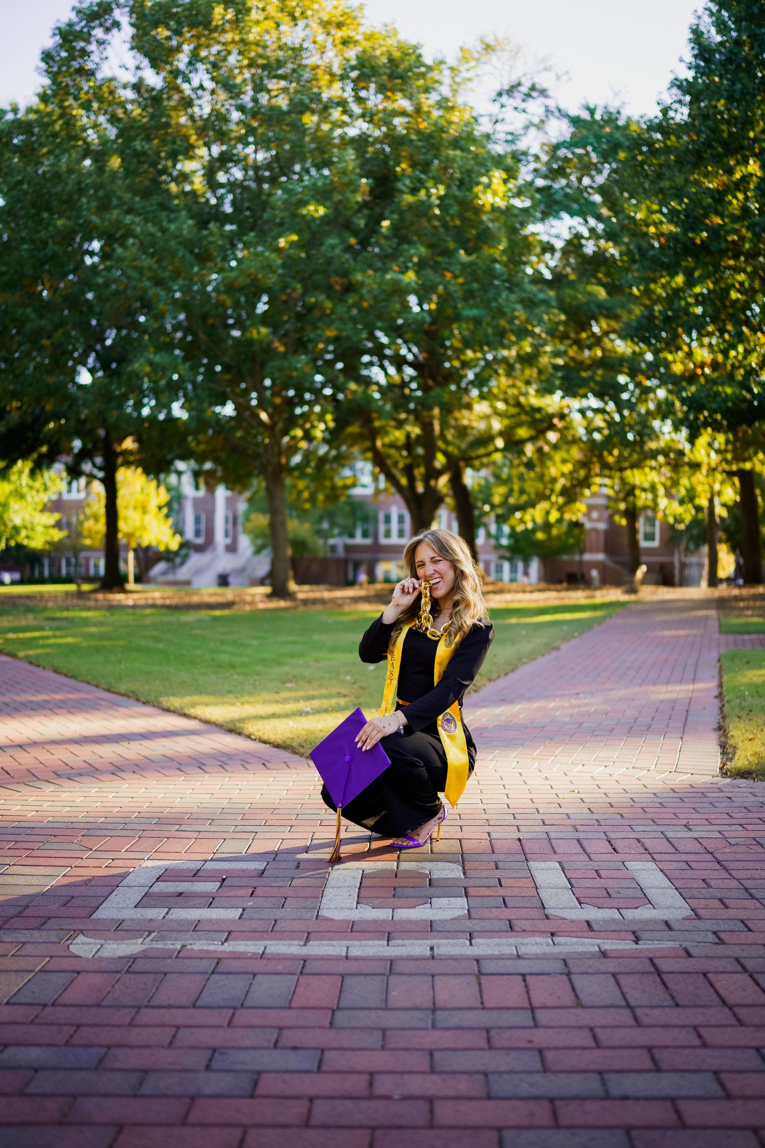 The Best ECU Grad Photos By Joan Avilez ECU grad photographer, ECU bricks by the mall