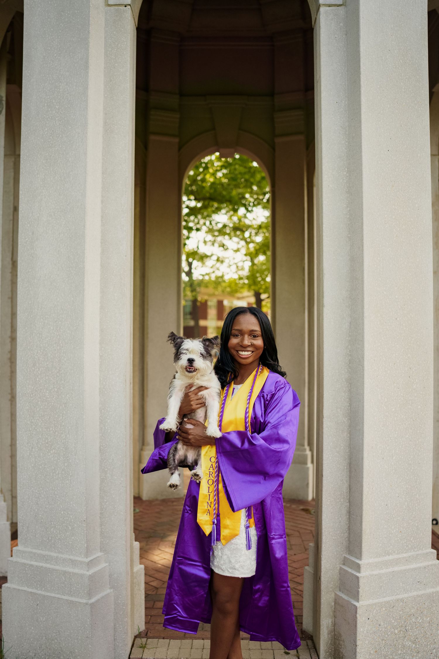 ECU Graduate poses on East carolina university's campus for the best ECU grad photos  by Joan Avilez ECU grad photographer at the cupola