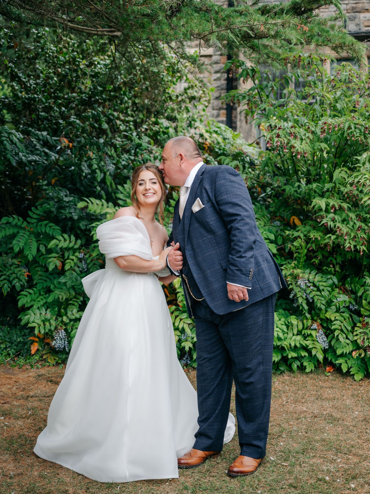 A romantic wedding sequence showing playful moments between newlyweds in a lush garden setting.