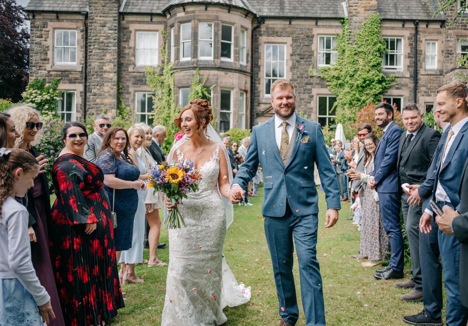 Bride and groom at Makeney Hall Derbyshire wedding Relaxed summer wedding reception in Makeney Hall Derbyshire countryside wedding photograp