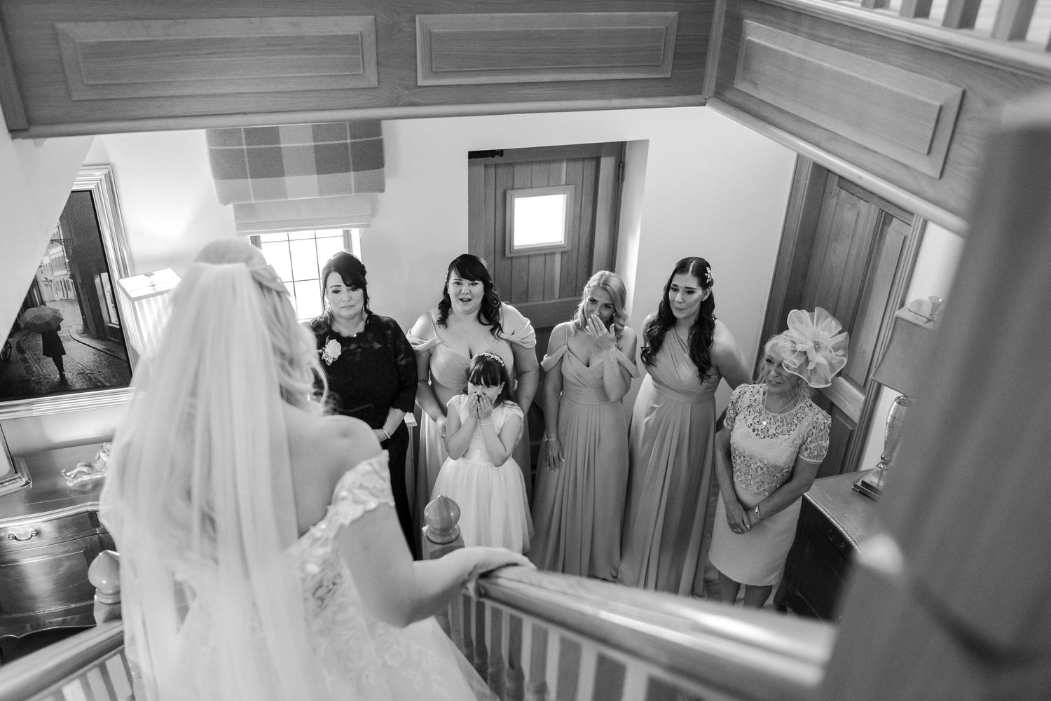 Wedding party preparations in an elegant indoor hallway.