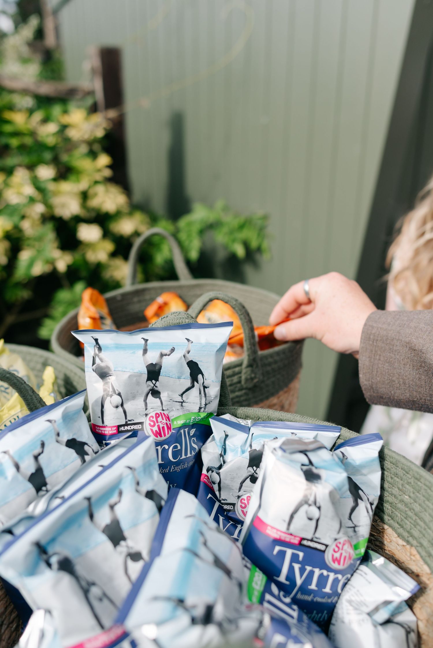 Multiple bags of Utz potato chips arranged in a casual outdoor setting.