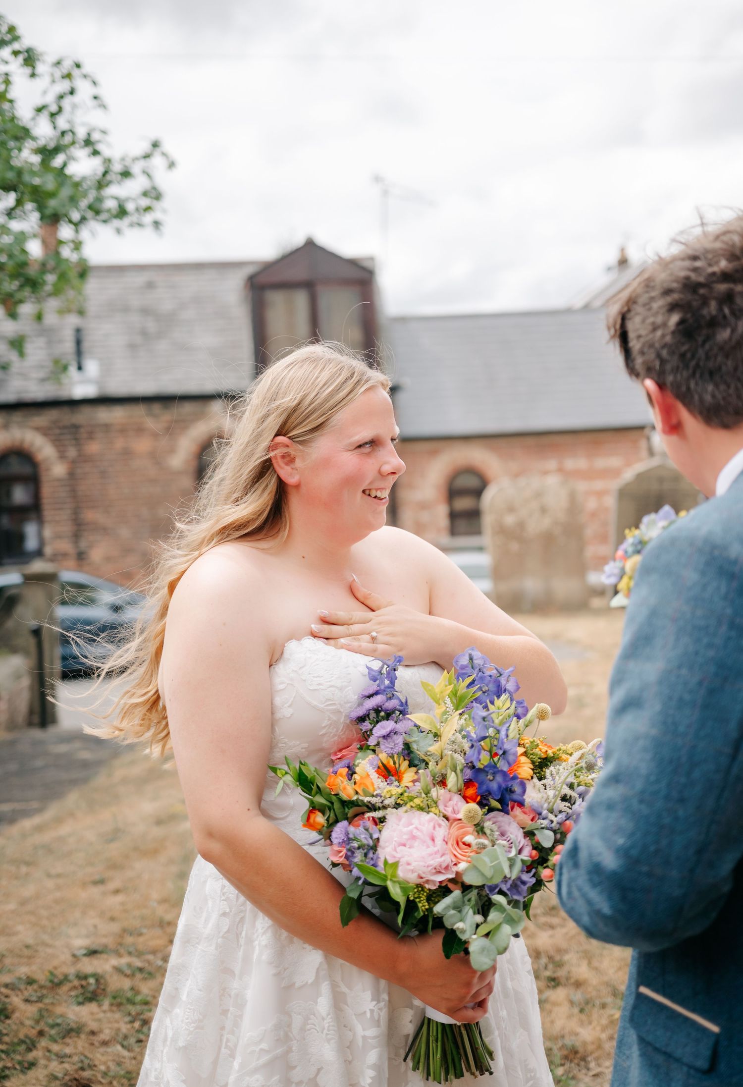 Candid wedding photos showing joyful moments with colorful bouquet of wildflowers.