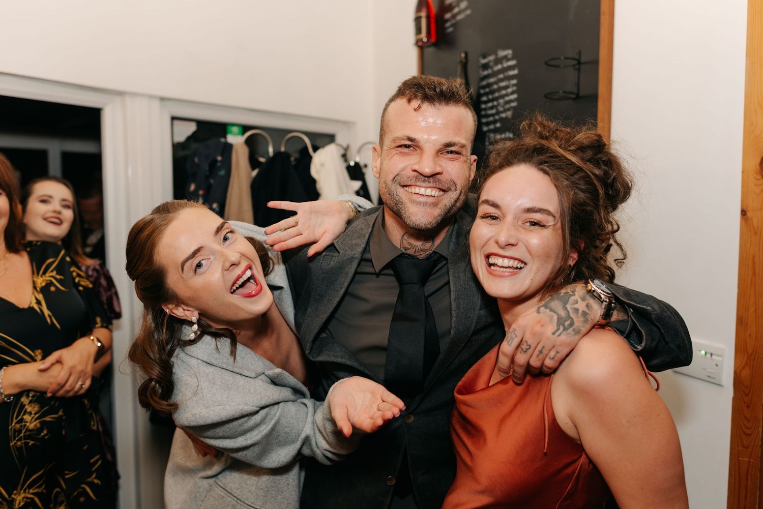 A sequence of four candid photo booth style images showing people laughing and posing together at a party.