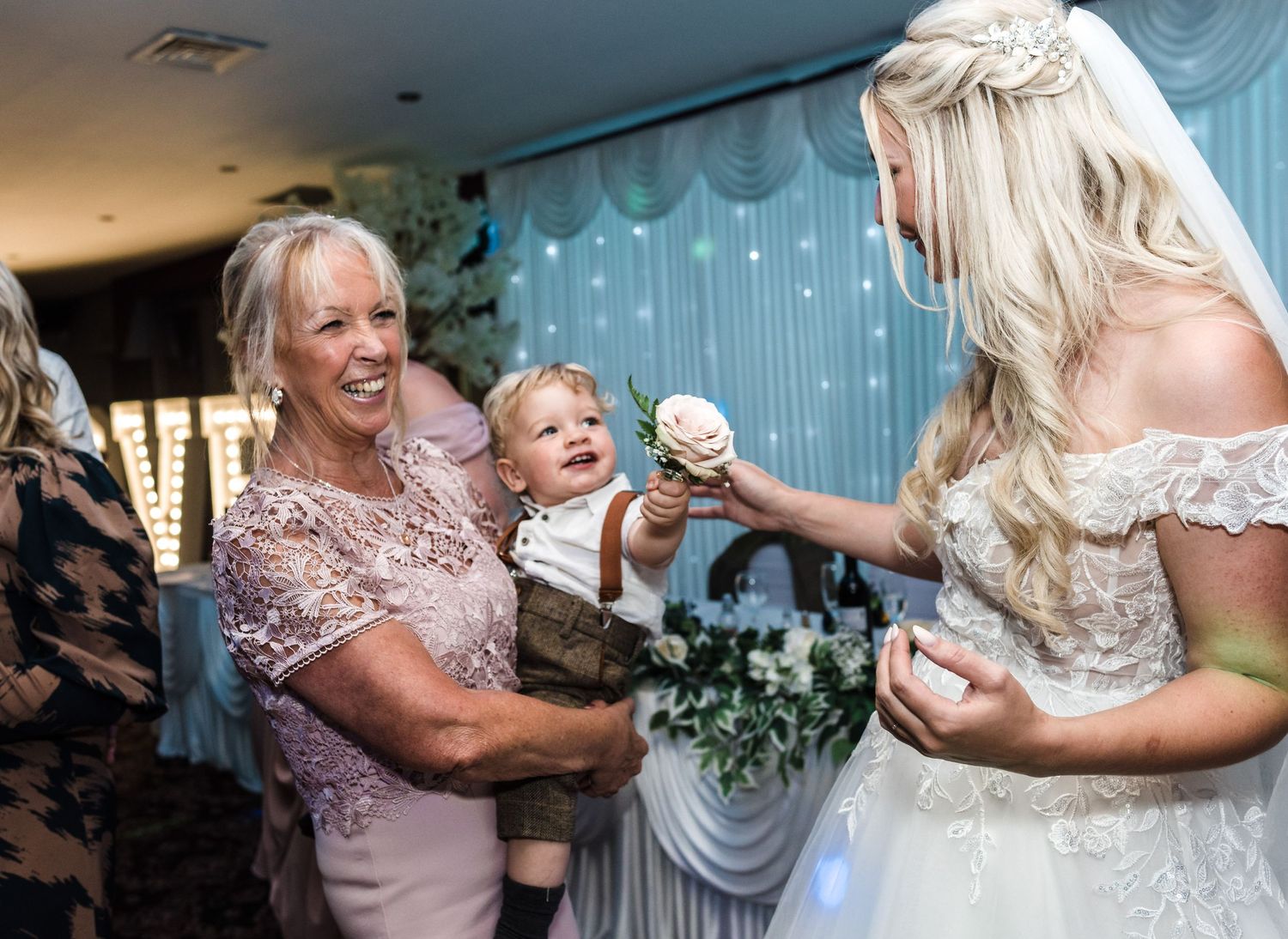 A sweet moment of sharing cake during wedding celebrations.