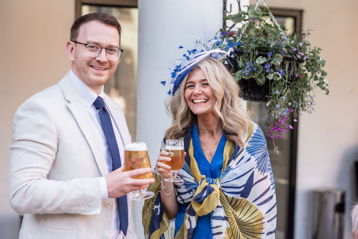 Elegant garden party toast with blue floral decorations and champagne glasses.