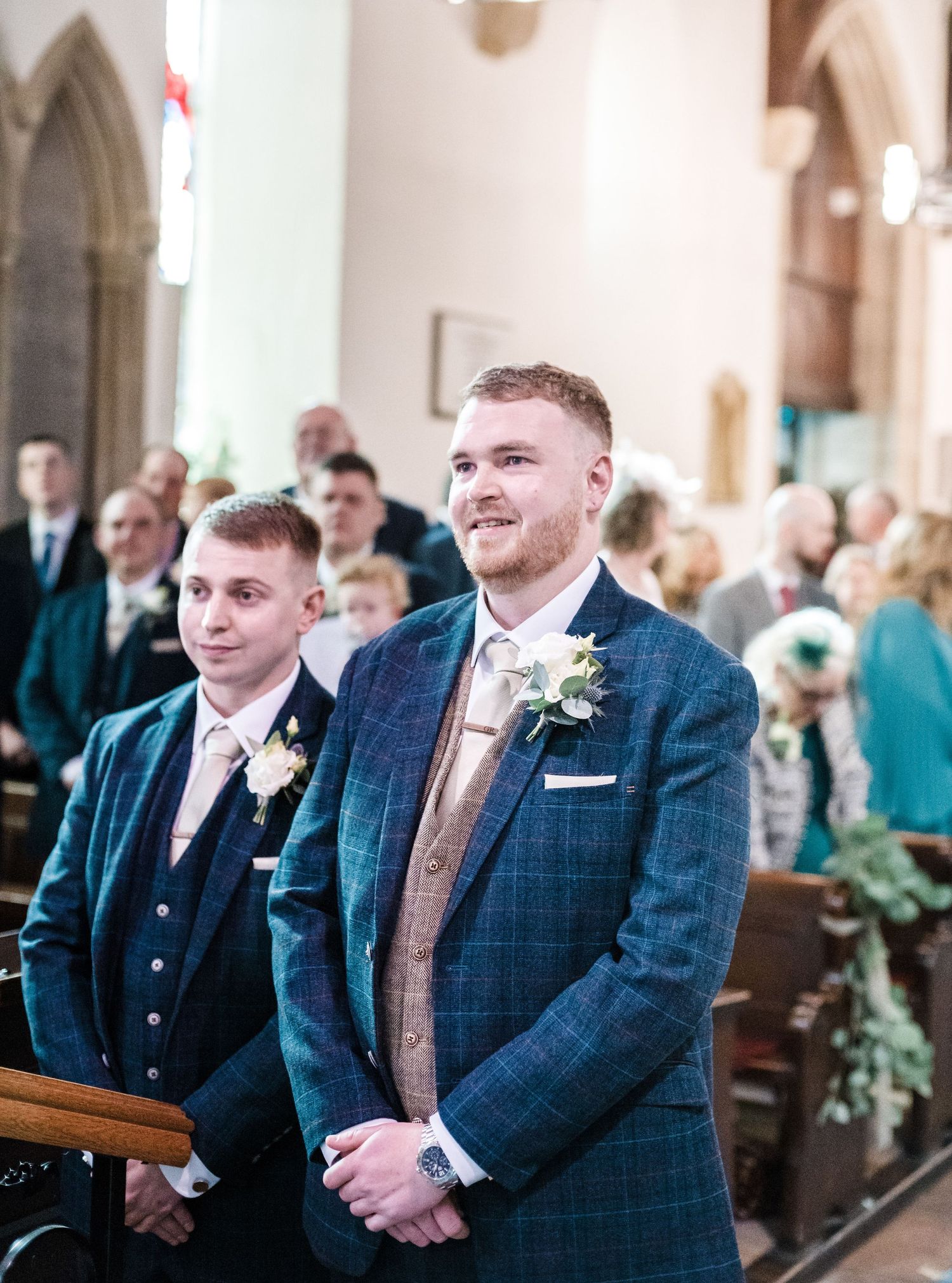 Wedding ceremony in a traditional church with gothic architecture and decorative details.