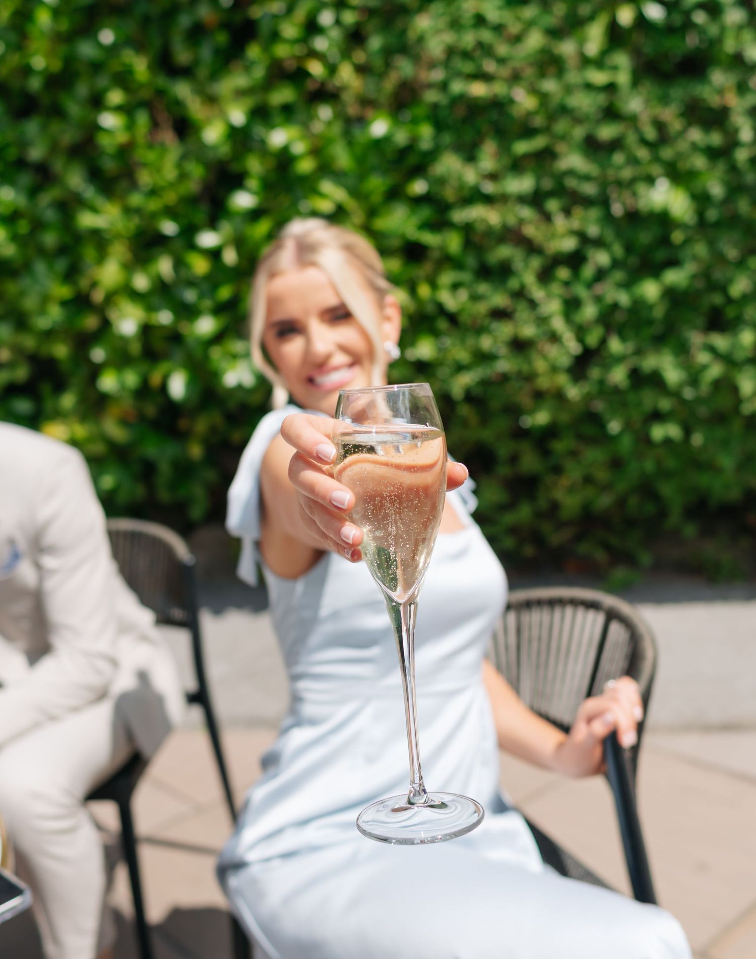 Wedding celebration sequence with champagne glasses and outdoor garden setting.