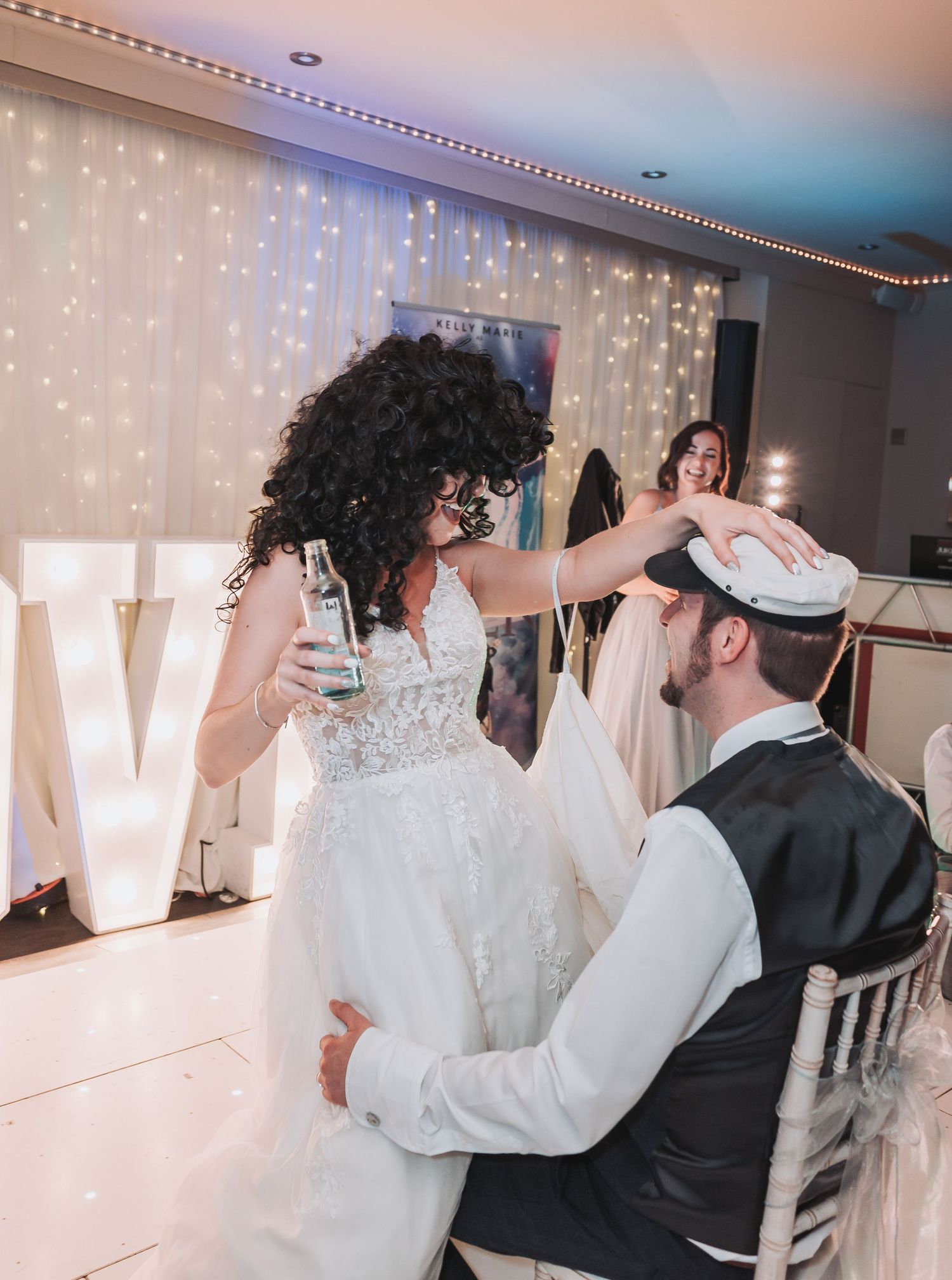 Fun wedding reception moment with guests dancing and celebrating together.