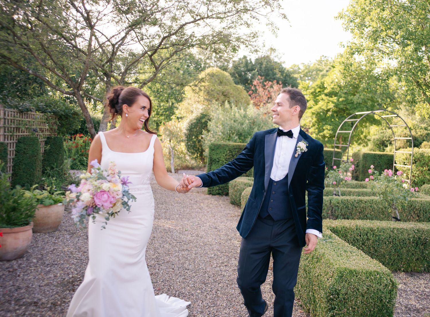 A romantic wedding photo sequence captured in a lush garden setting.