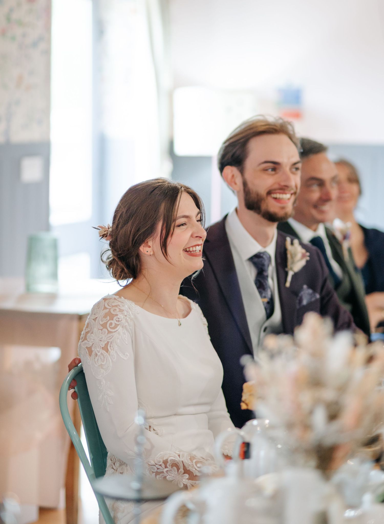 Wedding reception scene with elegant table settings and joyful moments.