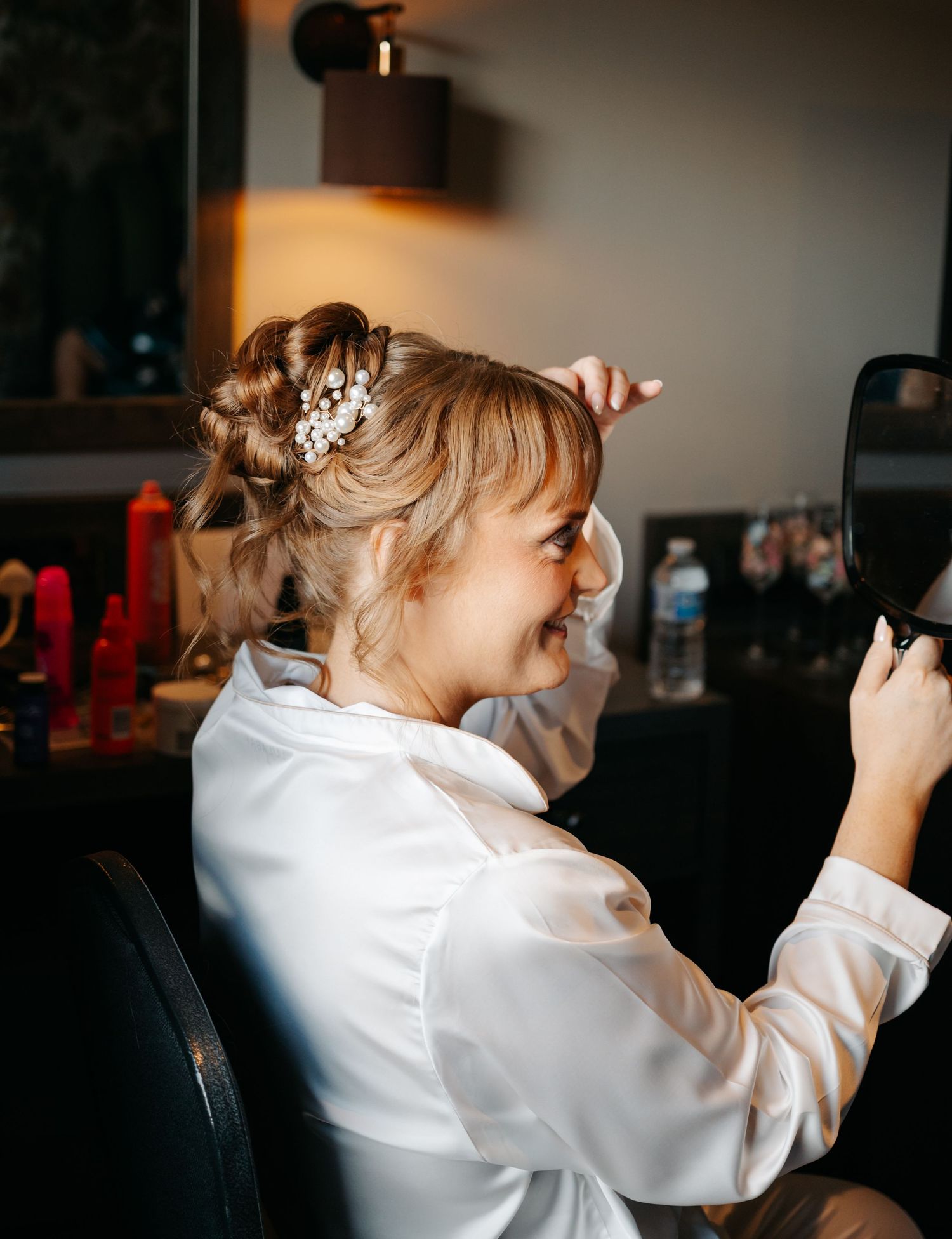 A sequence of candid shots showing someone in a white shirt looking through a camera lens.