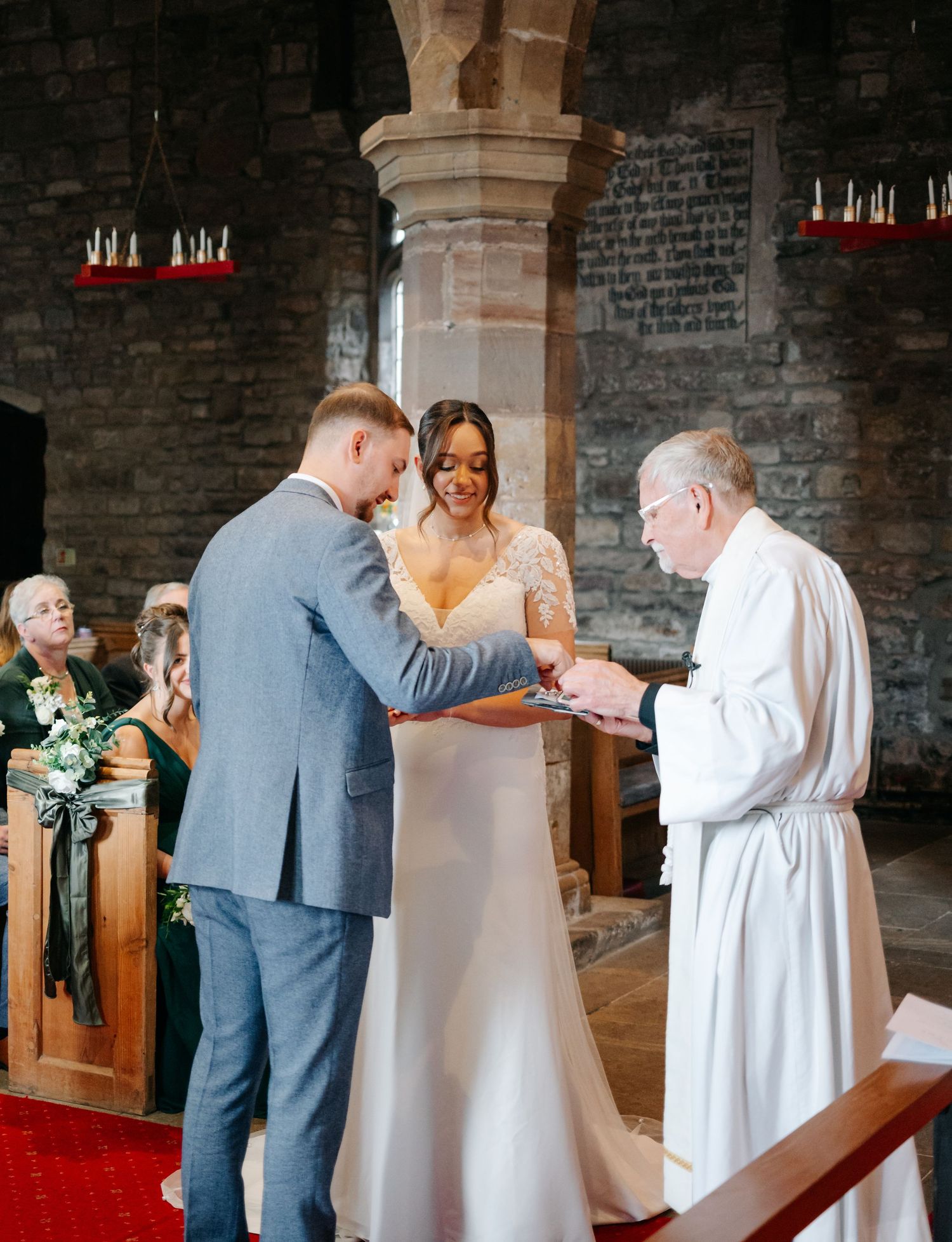 Traditional church wedding ceremony with clergy and couple at the altar.