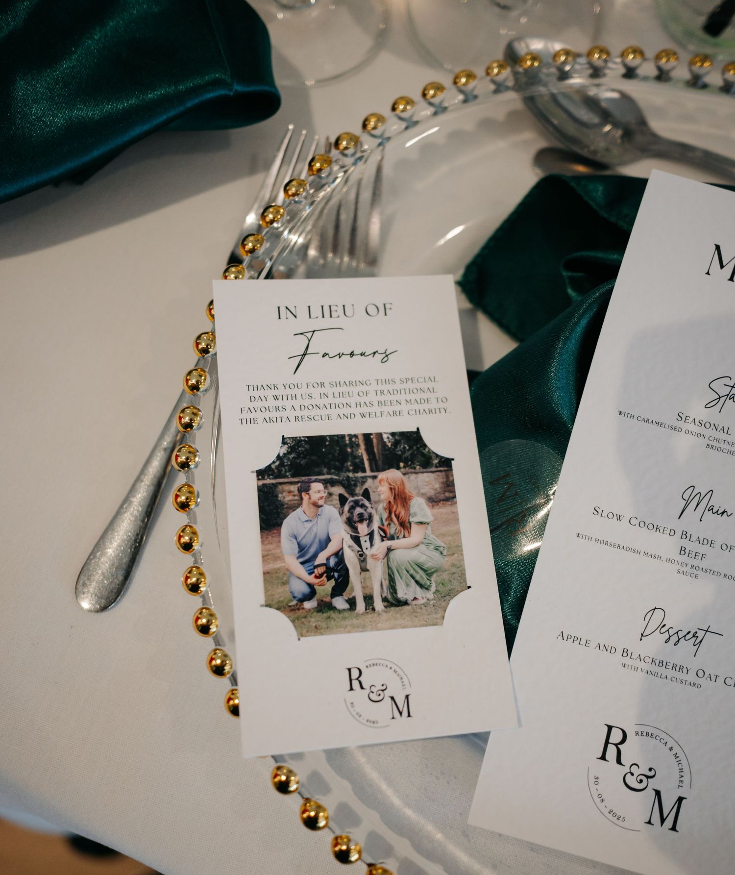 Wedding reception place settings with personalized photo cards and gold beaded decorations.