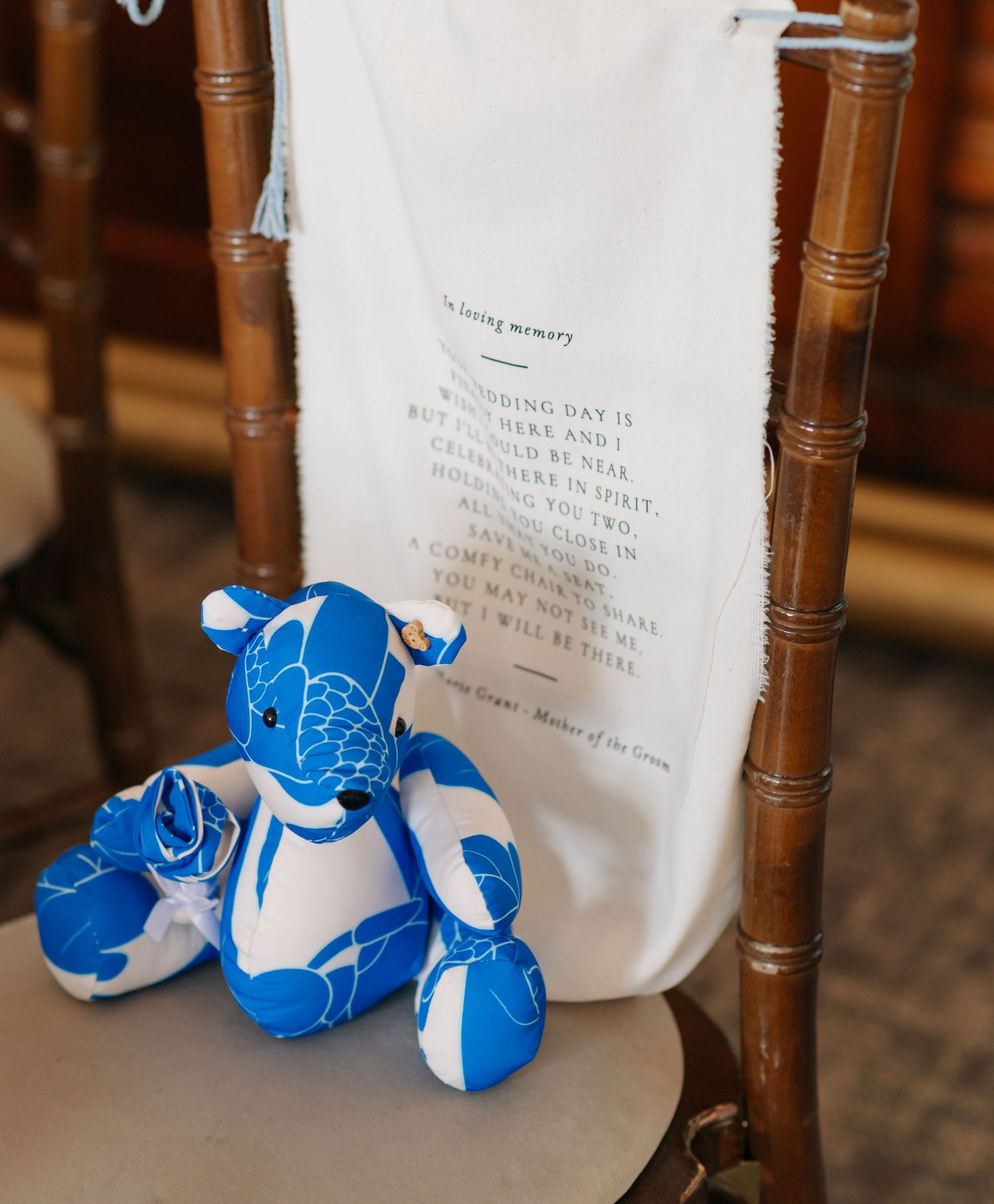 Blue and white decorative slippers arranged beneath wooden chairs.