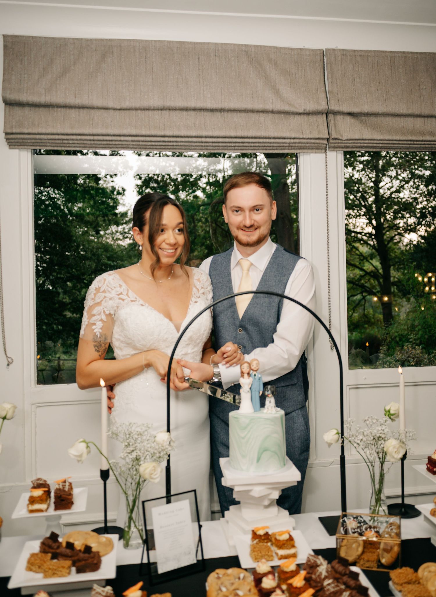 A series of photos showing a wedding cake cutting sequence with the couple slicing into a tiered white cake.