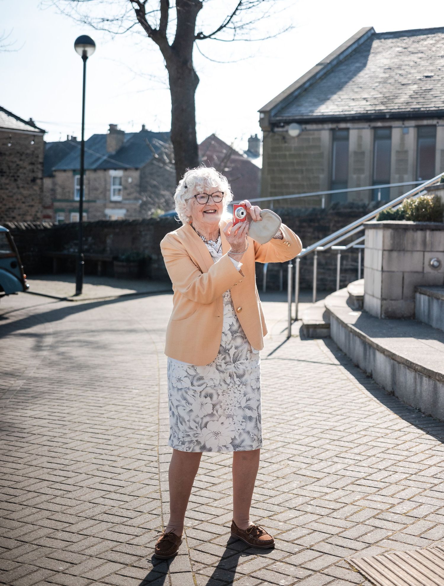 A sequence of playful dance moves on a sunny outdoor patio.