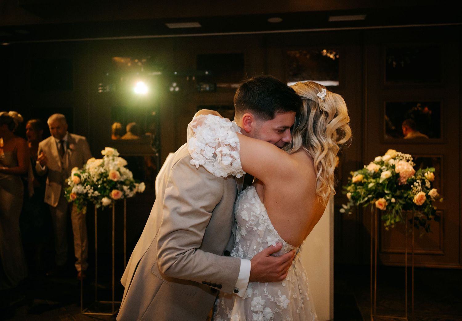 Romantic evening dance moments captured during wedding reception.