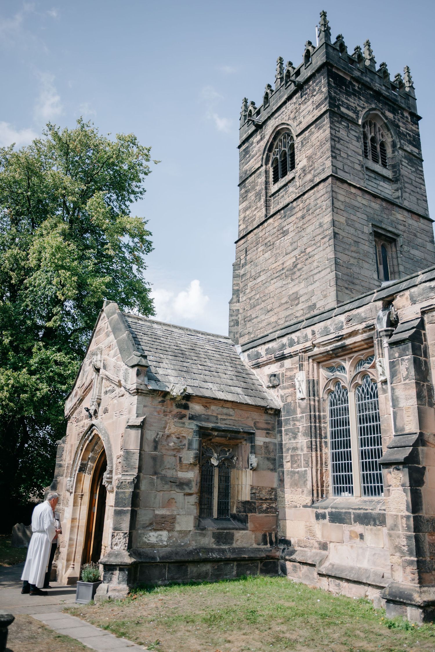Historic stone church exterior with Gothic architecture and tower shown from multiple angles on a sunny day.