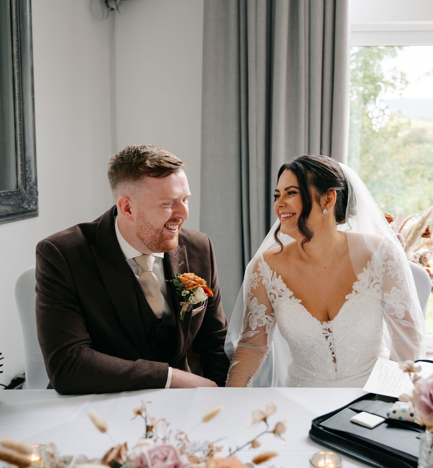 A series of candid wedding photos showing tender moments between the couple at a bright indoor venue.