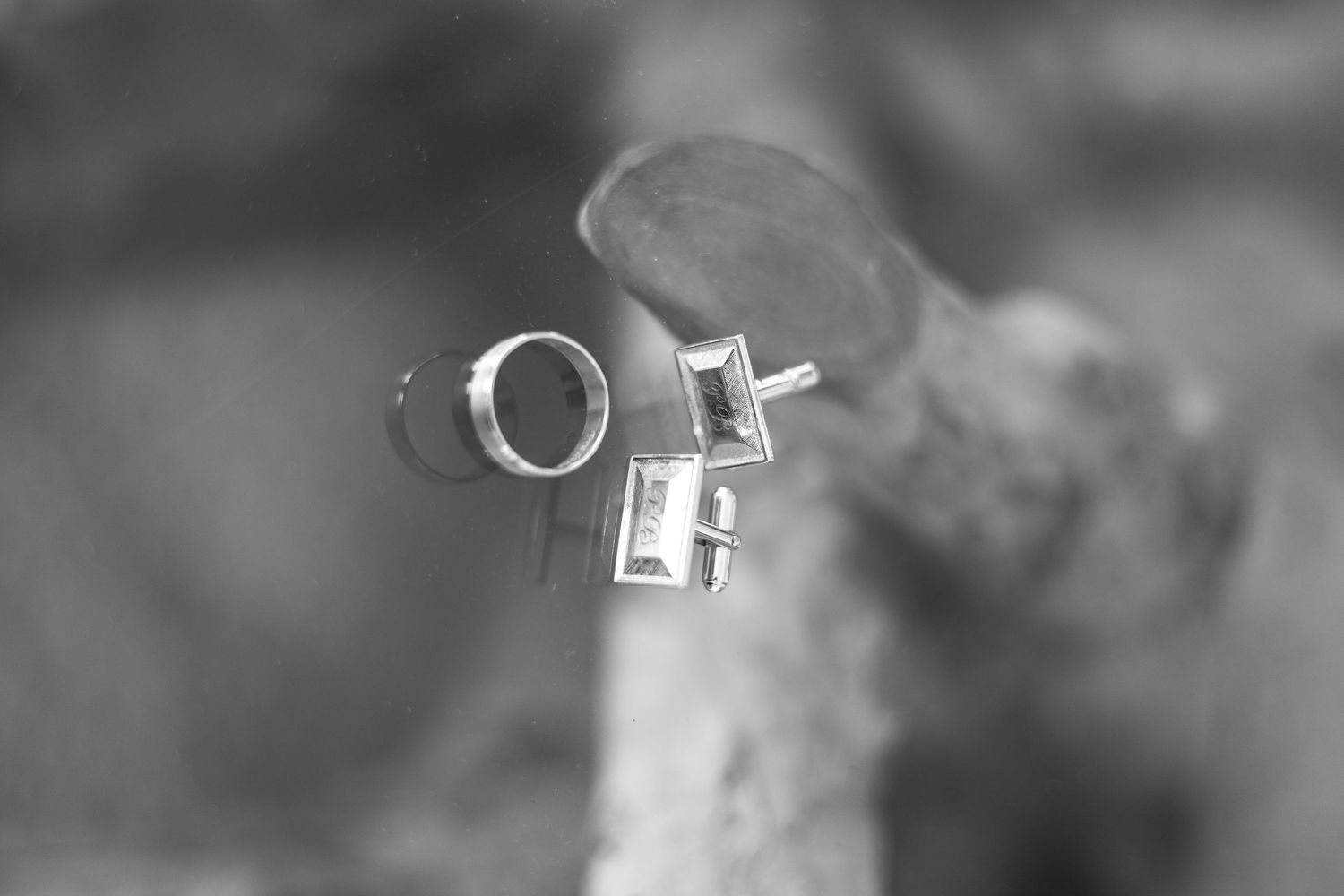 Wedding rings in soft focus creating artistic macro photography shot.