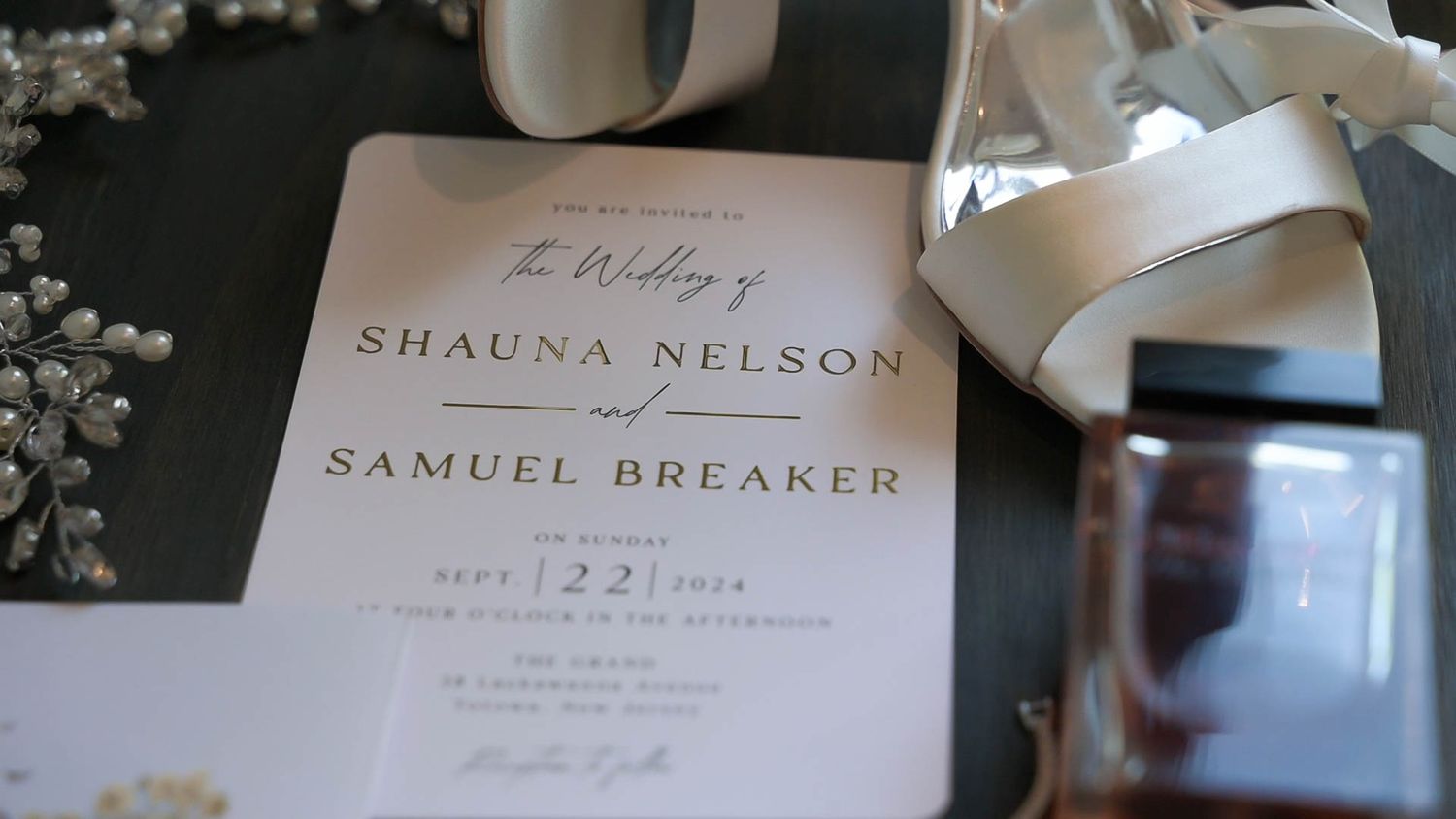 Wedding invitation details with elegant typography and floral elements.