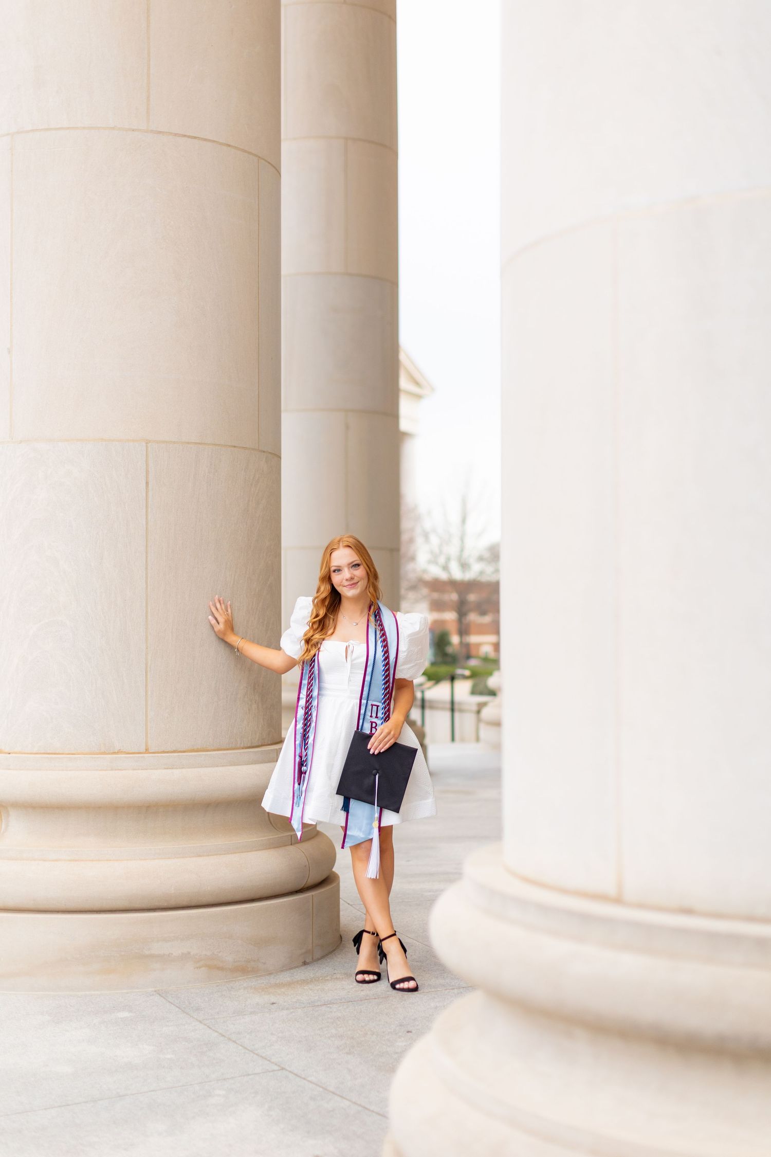 A series of architectural photos showing someone posing between large classical columns in a light, airy setting.