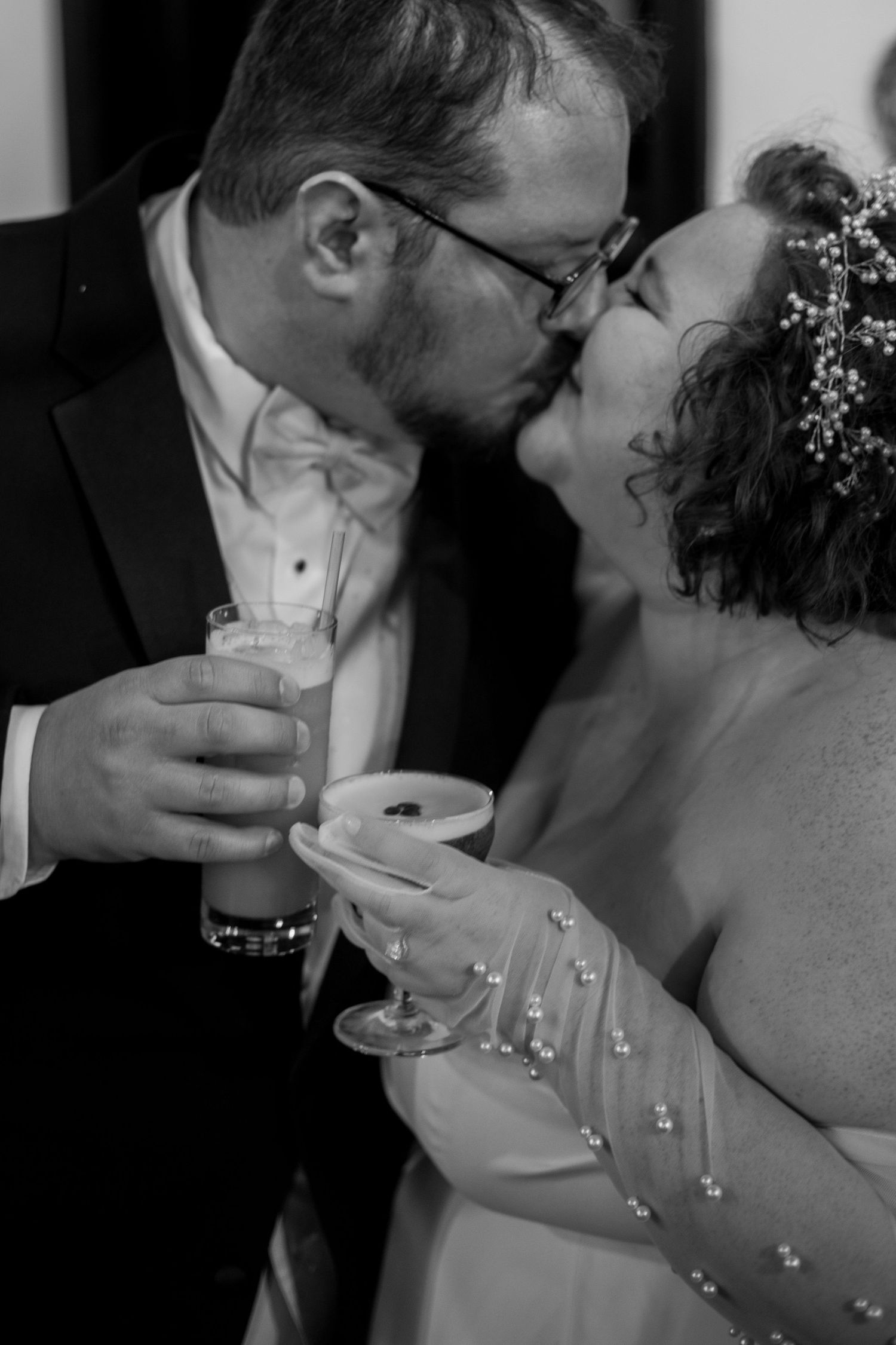 Romantic black and white photo of couple sharing cocktails and an intimate moment at Zion National Park Elopement.