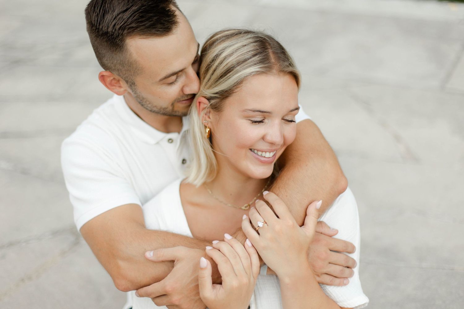 A tender embrace captured in a romantic outdoor setting.