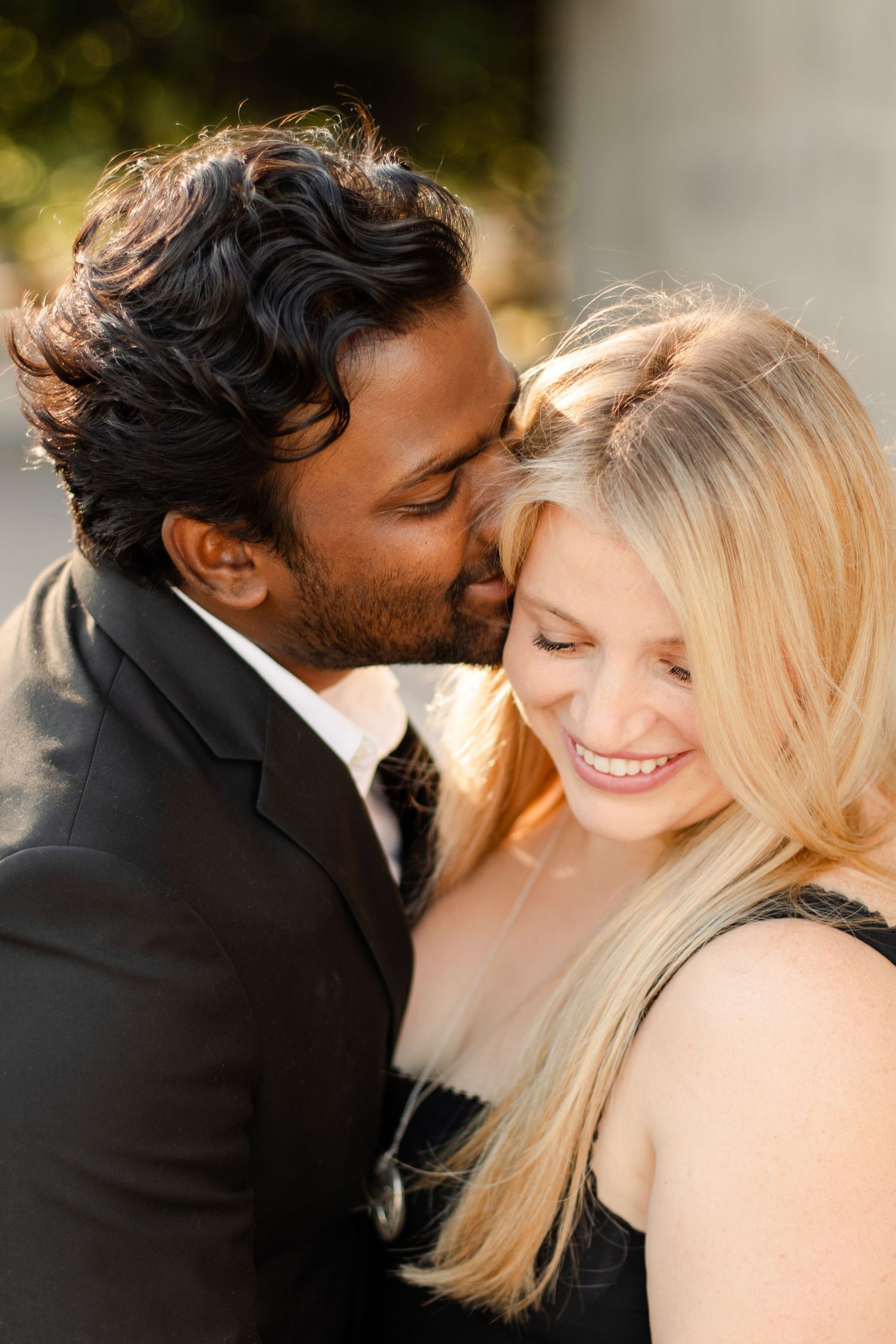 An intimate moment shared between a couple during a romantic outdoor photoshoot. Wedding photographer Hannah Rogg Taylor