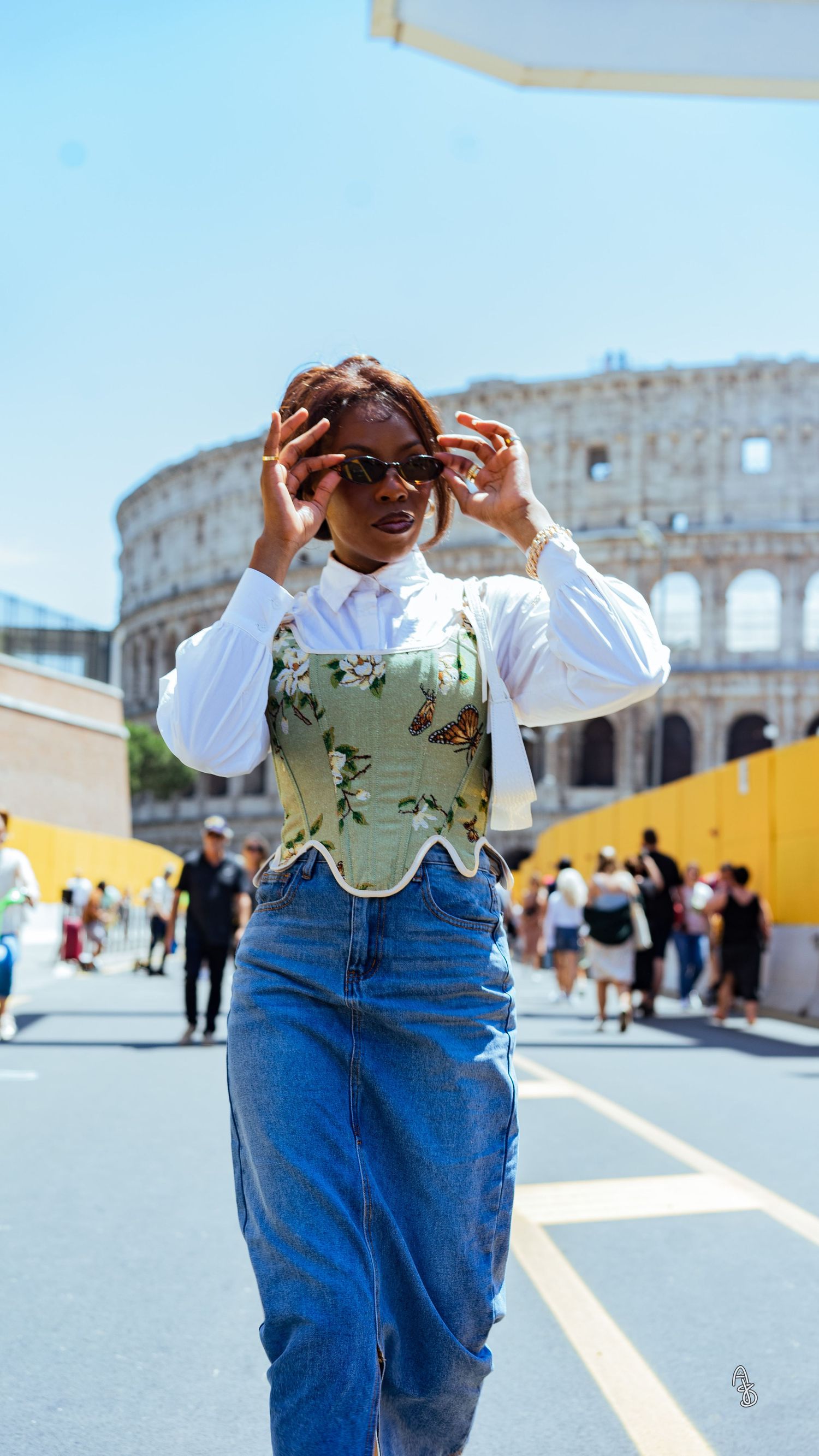 Women walking outside Rome Colosseum.
