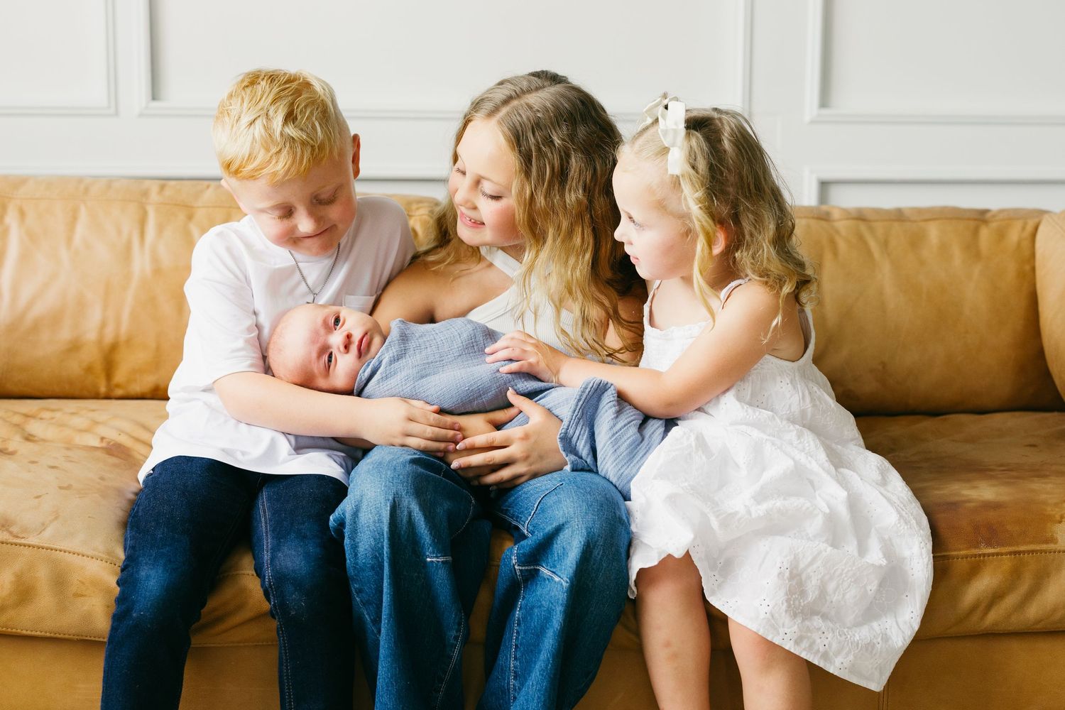 A series of candid family moments showing people sitting together on a brown leather couch in a bright room.