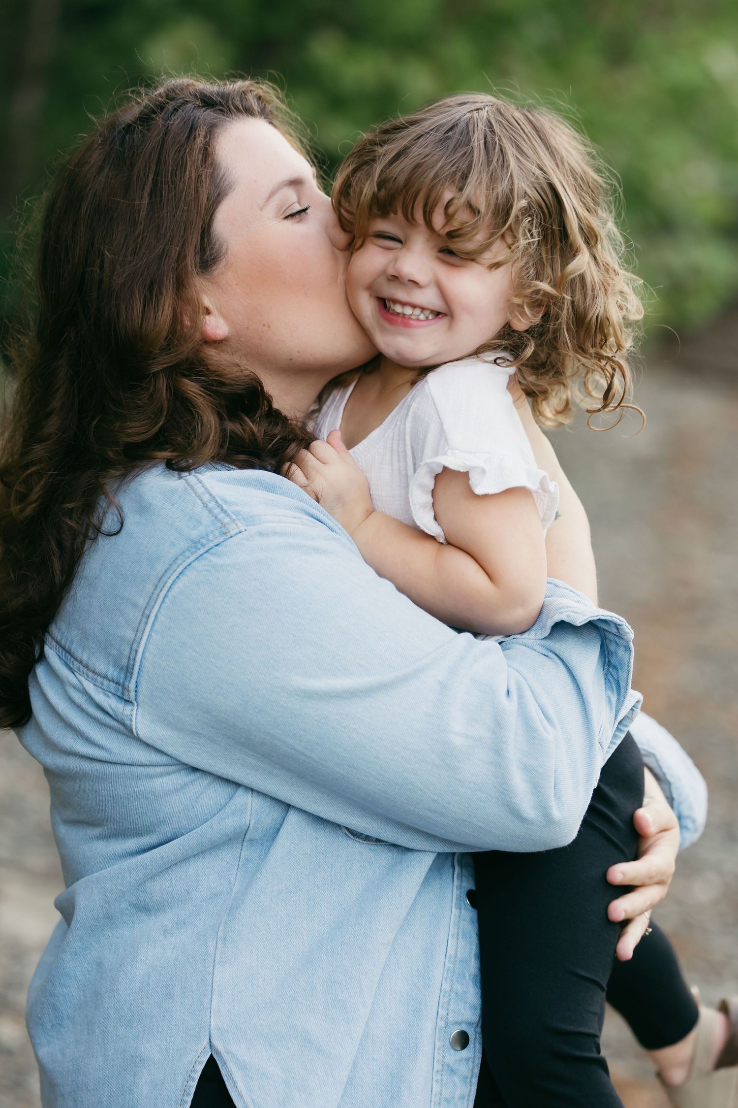 A tender moment captured in a series of candid photos showing affectionate embraces between two people in casual attire.
