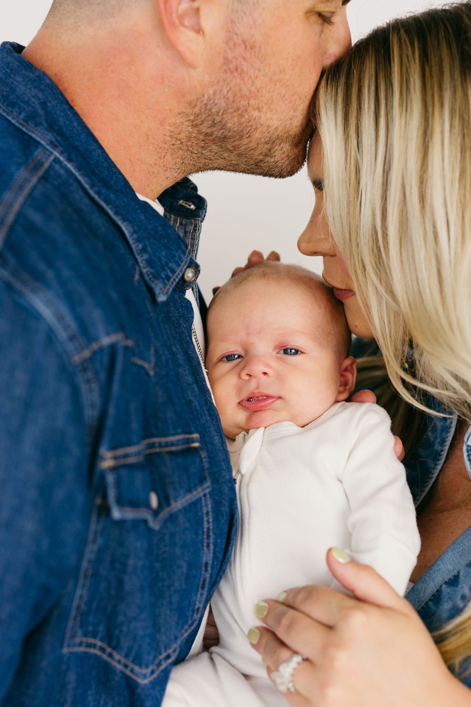 An intimate family moment captured in soft, warm tones.