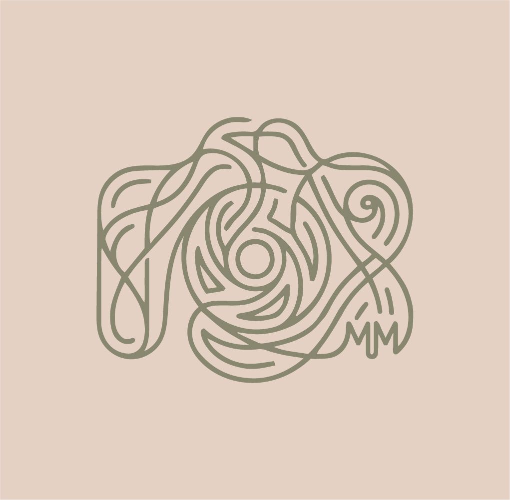 Intricate sage green monogram logo with swirling floral rose design and MM initials on a soft blush background.
