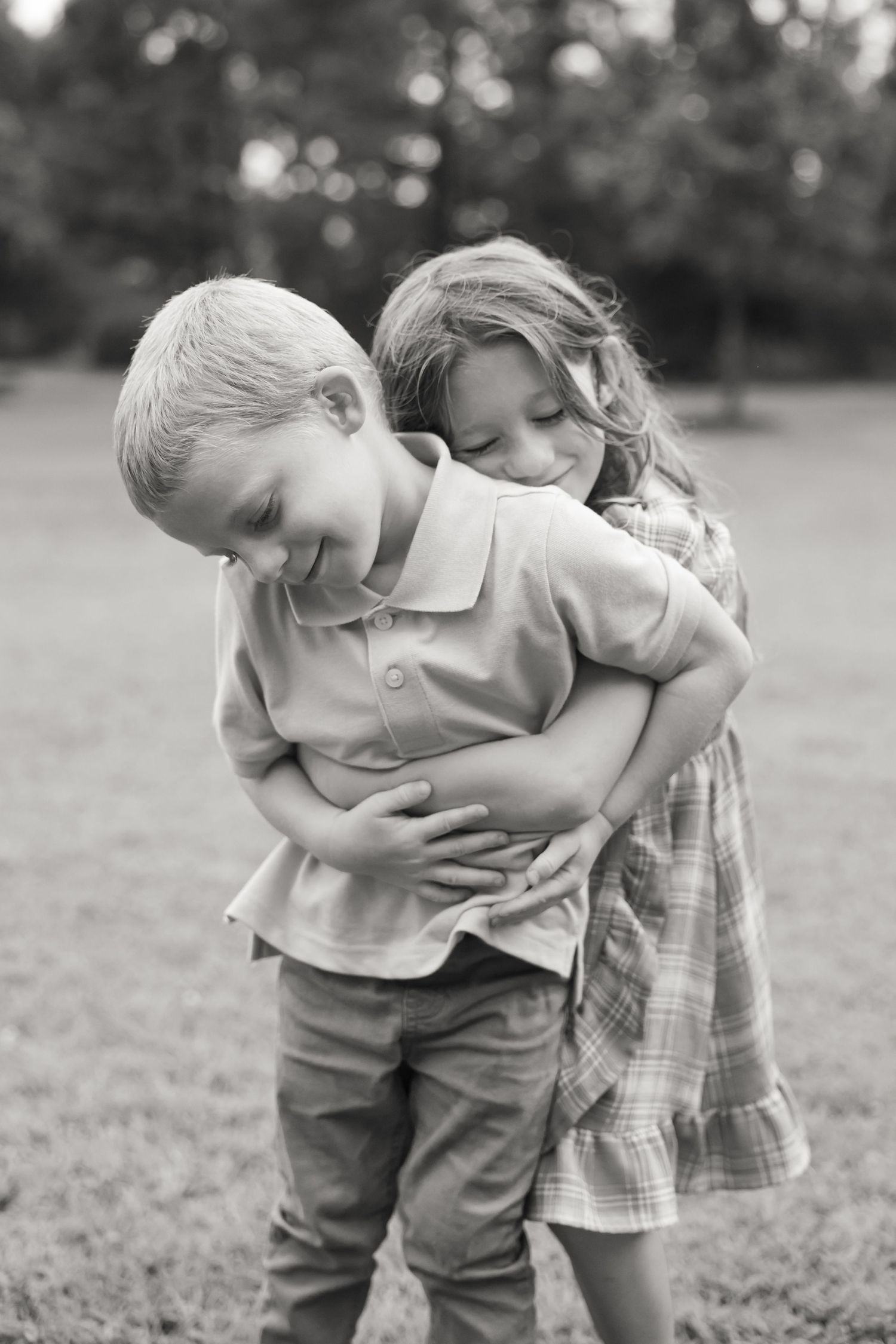 Black and white photos of young children playing together in an outdoor setting.