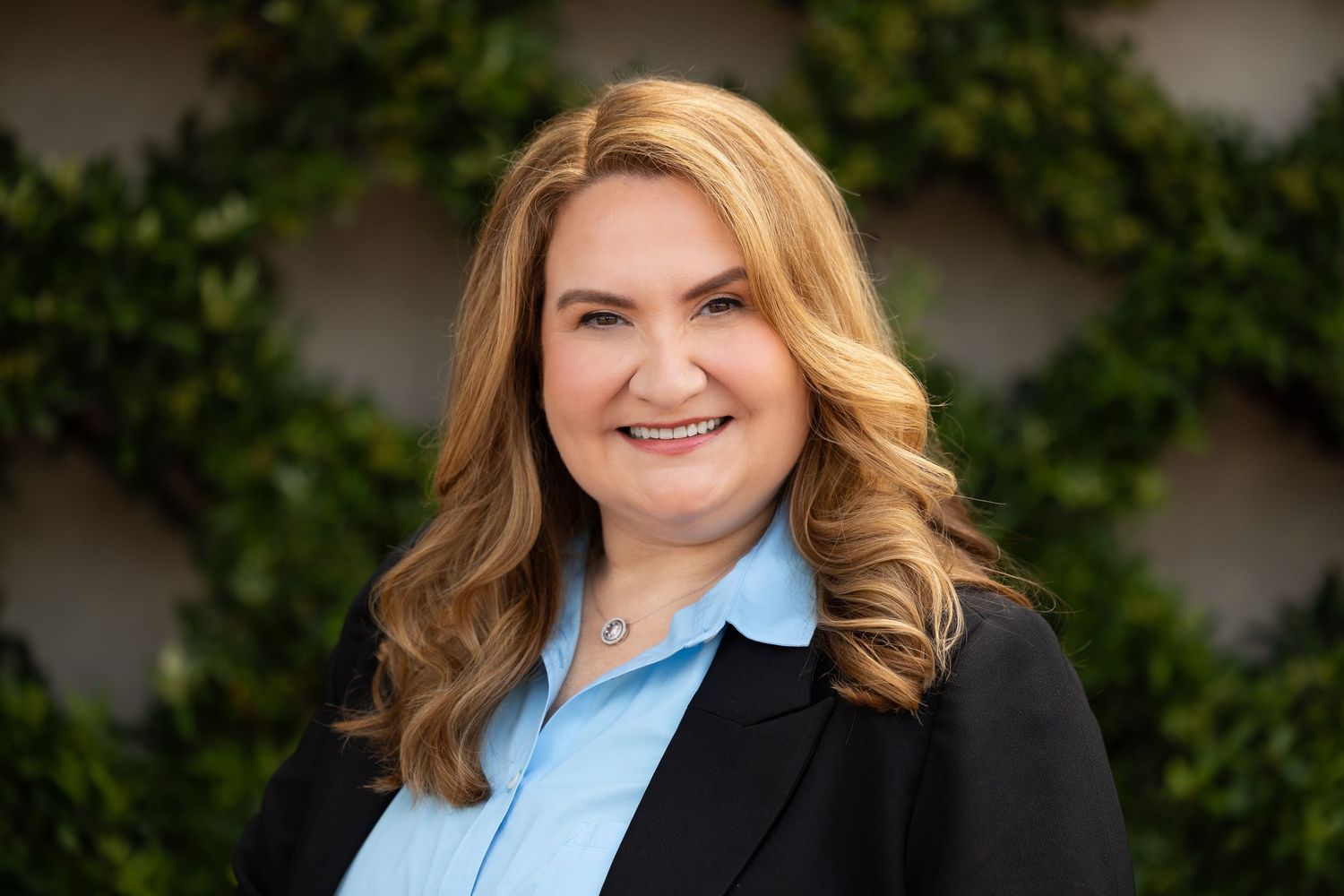 Professional headshots featuring business attire against neutral backdrop.
