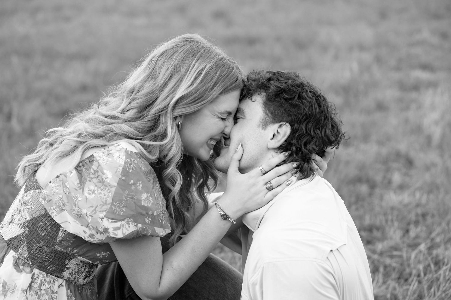 A romantic black and white photo collage shows couples sharing intimate kisses in outdoor settings.